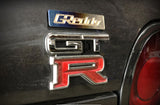 GReddy Optional Titanium "GReddy" Emblem - (70x15mm)