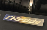 GReddy Optional Titanium "GReddy" Emblem - (105x20mm)