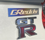 GReddy Optional Titanium "GReddy" Emblem - (105x20mm)