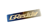 GReddy Optional Titanium "GReddy" Emblem - (70x15mm)